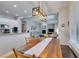 Spacious dining room with view to the living room and well equipped kitchen, creating a comfortable living space at 7256 Bugler Swan Way, North Las Vegas, NV 89084