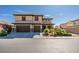 Stunning two-story home featuring a well-manicured front yard, multi-car garage, and neutral color palette in a quiet neighborhood at 7256 Bugler Swan Way, North Las Vegas, NV 89084