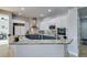 Charming kitchen with granite countertops, stainless steel appliances, and mosaic backsplash at 7256 Bugler Swan Way, North Las Vegas, NV 89084