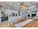Kitchen and dining area flowing into the living room, stainless steel appliances, fireplace and cozy seating at 7256 Bugler Swan Way, North Las Vegas, NV 89084