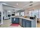 Kitchen with granite countertops, modern appliances, open layout, and seamless access to the living room at 7256 Bugler Swan Way, North Las Vegas, NV 89084