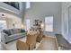 Bright and airy living room with comfortable seating, large windows, and seamless access to outdoor spaces at 7256 Bugler Swan Way, North Las Vegas, NV 89084