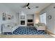 Bright living room with fireplace, comfortable couches, and a blue patterned rug at 7256 Bugler Swan Way, North Las Vegas, NV 89084