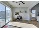 Open-concept living room with wood floors, lots of light, and view of backyard at 7256 Bugler Swan Way, North Las Vegas, NV 89084