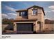Charming two-story home with a two-car garage, tile roof, and desert landscaping at 7446 Bosco Brook Dr # 50, North Las Vegas, NV 89084