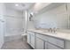 Bright bathroom features a double sink vanity, shower over tub and large mirror at 785 Black Palace St, Henderson, NV 89011