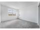 Bright bedroom with neutral carpeting and a view from the window, awaiting personal touches at 785 Black Palace St, Henderson, NV 89011