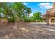 Large backyard area with soccer goal and beautiful green trees at 807 Canyon Greens Dr, Las Vegas, NV 89144