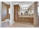 Bathroom featuring a bidet, custom cabinets and mirrors, and luxurious finishes at 807 Canyon Greens Dr, Las Vegas, NV 89144