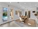 Bright dining area with glass doors overlooking pool and backyard views at 807 Canyon Greens Dr, Las Vegas, NV 89144