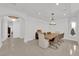 Formal dining room featuring modern light fixture and neutral color palette at 807 Canyon Greens Dr, Las Vegas, NV 89144
