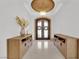 Grand entryway featuring a decorative door, tile flooring, and stylish console tables at 807 Canyon Greens Dr, Las Vegas, NV 89144