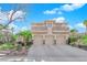 Stunning home featuring a three-car garage and a charming second-story balcony at 807 Canyon Greens Dr, Las Vegas, NV 89144