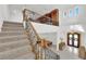 Grand foyer with soaring ceilings, wrought iron staircase, and double door entry at 807 Canyon Greens Dr, Las Vegas, NV 89144