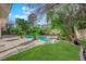 Lush backyard featuring a beautiful pool, spa, and meticulously landscaped garden, ideal for outdoor enjoyment at 807 Canyon Greens Dr, Las Vegas, NV 89144