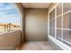 This neutral-toned balcony provides a serene outdoor space with large windows and city views at 9000 Las Vegas Blvd # 2243, Las Vegas, NV 89123