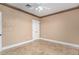 Neutral bedroom with ceiling fan, neutral paint, and light stone tile floors at 9000 Las Vegas Blvd # 2243, Las Vegas, NV 89123