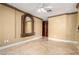 Spacious living room with unique wall mirror and decorative crown molding at 9000 Las Vegas Blvd # 2243, Las Vegas, NV 89123