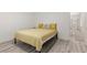 Bedroom featuring a bed with yellow quilt and hallway access at 9228 Whitekirk Pl, Las Vegas, NV 89145
