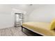Simple bedroom with open black closet and window with shutters at 9228 Whitekirk Pl, Las Vegas, NV 89145