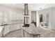 Modern kitchen features stainless steel appliances, a gas cooktop, a wine cooler and access to the patio at 9228 Whitekirk Pl, Las Vegas, NV 89145