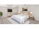 Airy main bedroom features a light color palette, shutters, and a gold accent decor at 9228 Whitekirk Pl, Las Vegas, NV 89145