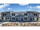 Contemporary townhouse featuring modern two-tone exterior, neutral landscaping, and inviting walkways at 9403 Jade Mesa St # 40, Las Vegas, NV 89139