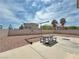 Expansive backyard offering desert landscaping, a picnic table, and privacy walls at 9509 Arrowhead Falls Ct, Las Vegas, NV 89148