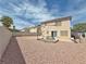 Large backyard space with a gravel landscape, picnic table, and covered patio area at 9509 Arrowhead Falls Ct, Las Vegas, NV 89148