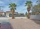 Property showcasing an extra-long driveway, perfect for RV parking, surrounded by lush palm trees at 9509 Arrowhead Falls Ct, Las Vegas, NV 89148
