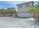 Two-story home with a large driveway and basketball hoop, great for outdoor fun at 9509 Arrowhead Falls Ct, Las Vegas, NV 89148
