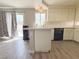 Well-lit kitchen features a breakfast bar with updated countertops and sink at 9509 Arrowhead Falls Ct, Las Vegas, NV 89148
