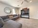 Comfortable living room with large sectional couch, TV, and modern decor at 9509 Arrowhead Falls Ct, Las Vegas, NV 89148