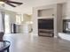 Open living room with views to kitchen, light walls, floors and door to backyard at 9509 Arrowhead Falls Ct, Las Vegas, NV 89148