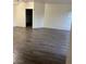Spacious living room featuring wood-look tile flooring and neutral paint, offering a modern and inviting space at , Las Vegas, NV 89118