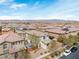 Aerial view of a neighborhood with many similar two-story homes, desert landscaping, and mountain views at 10943 Ketchikan St, Las Vegas, NV 89179