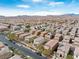 Extensive aerial shot of a community featuring homes with tile roofs and desert landscaping at 10943 Ketchikan St, Las Vegas, NV 89179