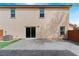 Enclosed patio featuring a paved surface, small patch of artificial grass, and sliding glass doors at 10943 Ketchikan St, Las Vegas, NV 89179