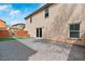 Paver stone backyard featuring privacy wall, grass, and access to the home at 10943 Ketchikan St, Las Vegas, NV 89179