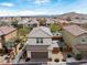 Charming two-story home featuring a tile roof, paired garage, and low-maintenance landscaping at 10943 Ketchikan St, Las Vegas, NV 89179