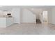 Open-concept living space with easy access to stairs, kitchen, and powder room at 10943 Ketchikan St, Las Vegas, NV 89179