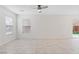 Bright, open living space with tile floors and plenty of natural light from the window at 10943 Ketchikan St, Las Vegas, NV 89179