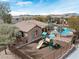 View of a playground and community center near a pool with mature landscaping at 10943 Ketchikan St, Las Vegas, NV 89179