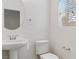 Stylish half bathroom with modern fixtures and a pedestal sink at 10943 Ketchikan St, Las Vegas, NV 89179