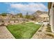 Expansive backyard with desert landscaping, a patio area, and views of the mountains at 11137 Black Fire Opal Dr, Las Vegas, NV 89138
