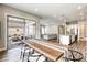 Bright dining area with sliding door access to an outdoor patio and view into the living space at 11137 Black Fire Opal Dr, Las Vegas, NV 89138