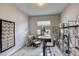 Bright home office with an adjustable standing desk, soft rug, and floor-to-ceiling bookshelves at 11137 Black Fire Opal Dr, Las Vegas, NV 89138