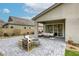 This patio boasts a comfortable seating area, fire pit, and smooth pavers, ideal for outdoor living and entertaining at 11137 Black Fire Opal Dr, Las Vegas, NV 89138