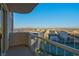 Daytime view from a balcony showcasing a driving range and city skyline at 125 E Harmon Ave # 2220, Las Vegas, NV 89109
