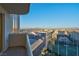 Daytime balcony view overlooking the cityscape and driving range at 125 E Harmon Ave # 2220, Las Vegas, NV 89109